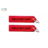 Personalized Embroidered Keychains Black Words On Red Background With Merrow Edge for sale