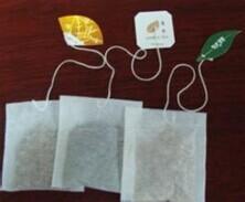 China 55*62.5mm food grade three side heat seal tea bag with string and tag on sale