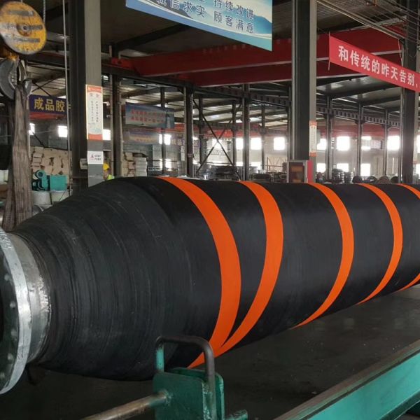 Floating dredge hose deployment in marine environment
